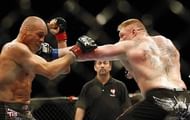 Brock Lesnar smashes the champion with a big time left hand
